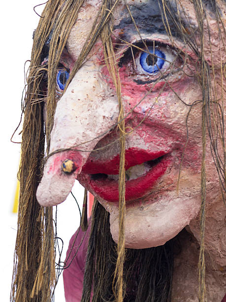 Portrait of Witches Lisa at Cerknica carnival Slovenia Cerknica, Slovenia - February 15, 2015:Side view, portrait of the witches Lisa with blue eyes, red lips, long ragged hair and nose ring. In background is light sky. She Is on street in Cerknica during carnival time. cerknica lake stock pictures, royalty-free photos & images
