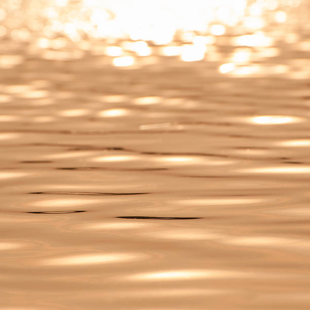 istock seamless texture warm color shining sunset water surface 494741333