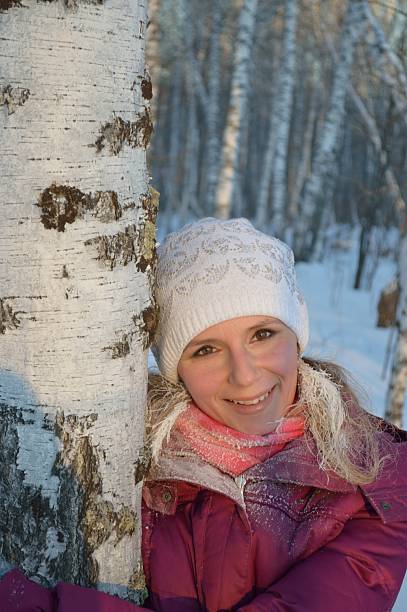 istock Beautiful girl and birch in winter forest 494741977