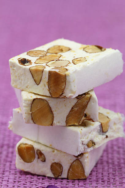 istock Almond nougat on pink background 494742123