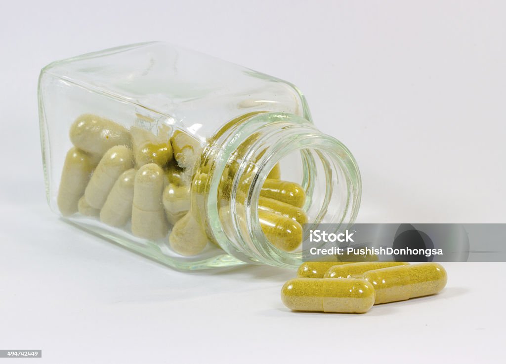 Herbal capsule The herbal capsule on white background for alternative medicine. Alternative Medicine Stock Photo