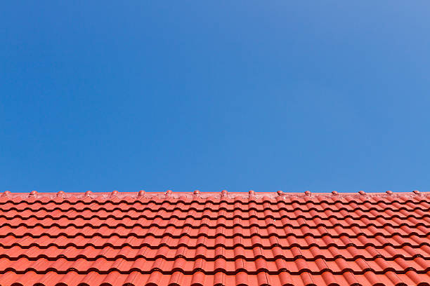 istock Red roof against blue sky 494743775