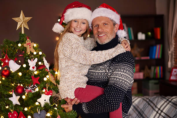 istock Daddy, me and our beautiful Christmas tree 494752698
