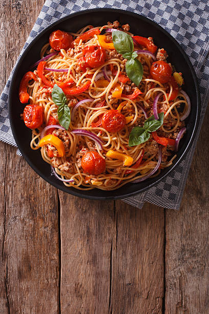 istock Spaghetti with minced and vegetables. vertical top view 494755450