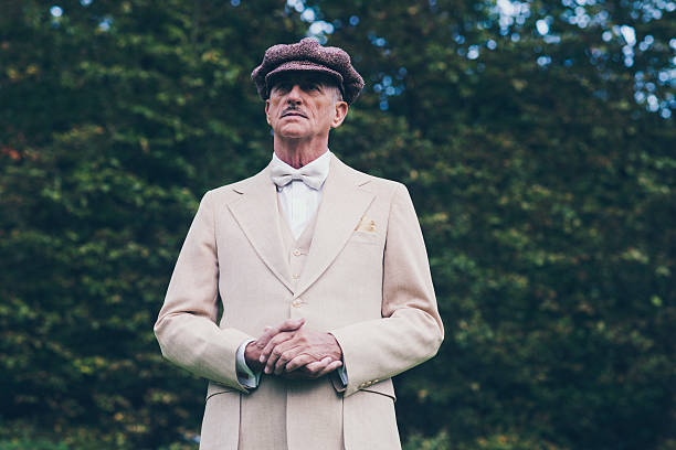 istock Well dressed gentleman in front of hedge. 494755698