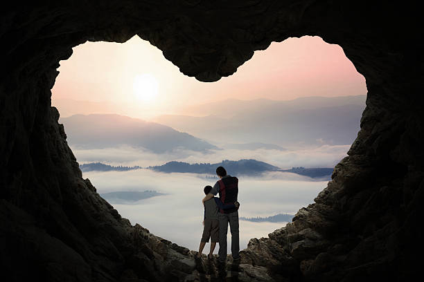 istock Young father in cave with his son 494761342