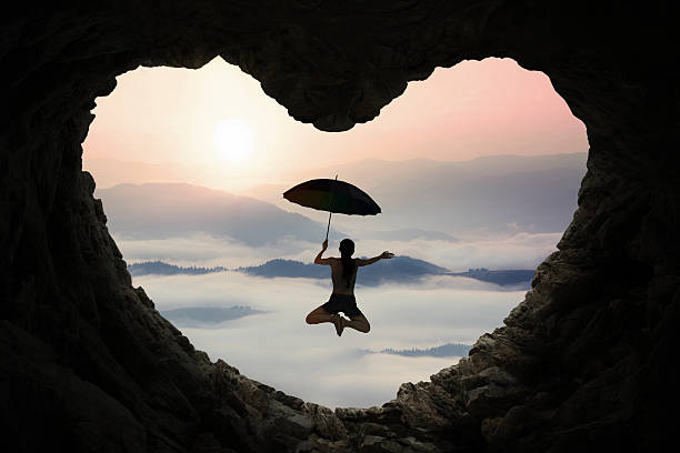 istock Woman jumping inside cave shaped heart 494761694