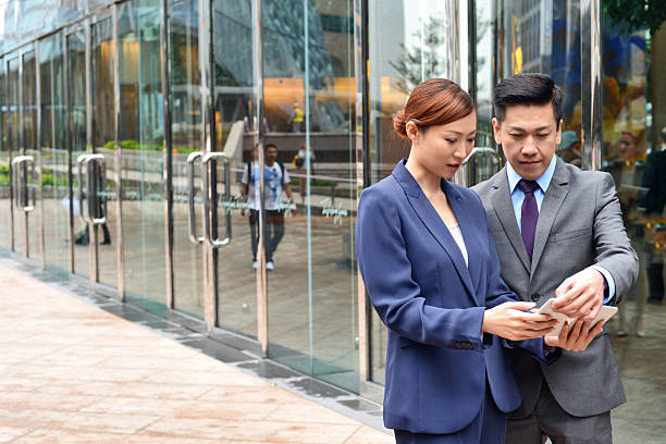 istock Man and Woman looking at Tablet 494761939