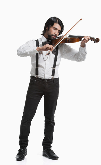 Young man playing violin (isolated on white)