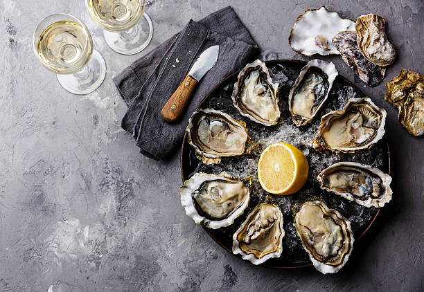 istock Opened Oysters Fines de Claire and white wine 494762054