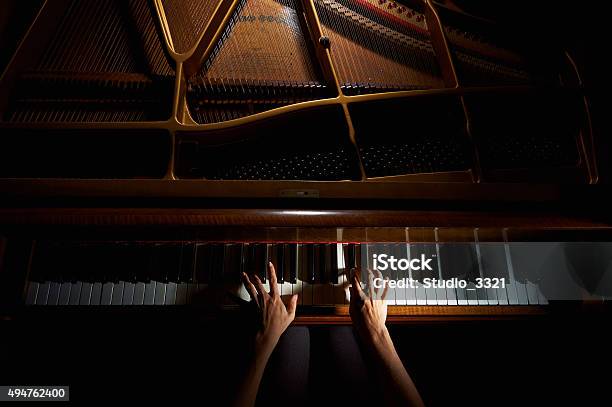 Womans Hands On The Keyboard Of The Piano In Night Stock Photo - Download Image Now