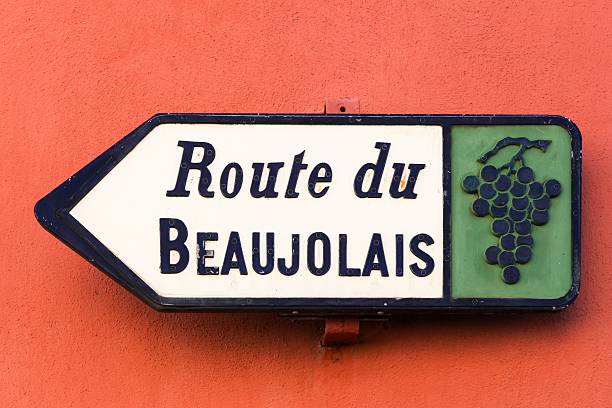 Route du Beaujolais sign, France Road of Beaujolais sign on a wall, France  beaujolais stock pictures, royalty-free photos & images