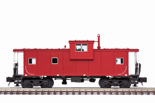 A red railroad caboose on track.