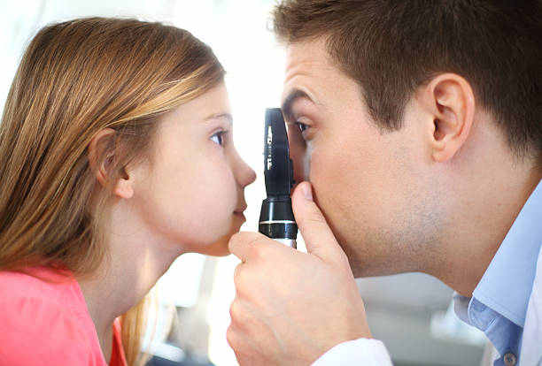 istock Little girl at optician's office. 494765635