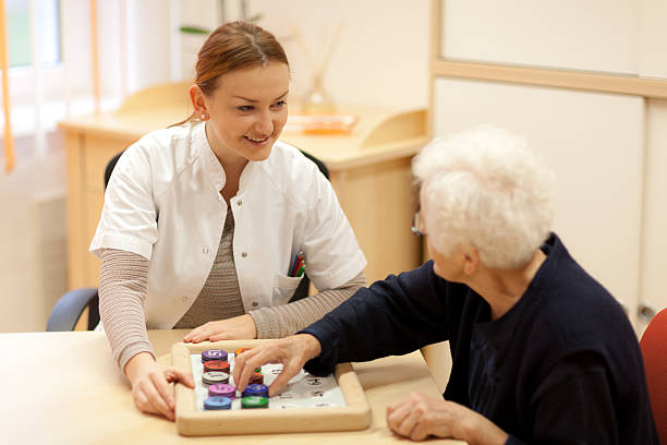 istock psychotherapist with old woman during memory training 494765949