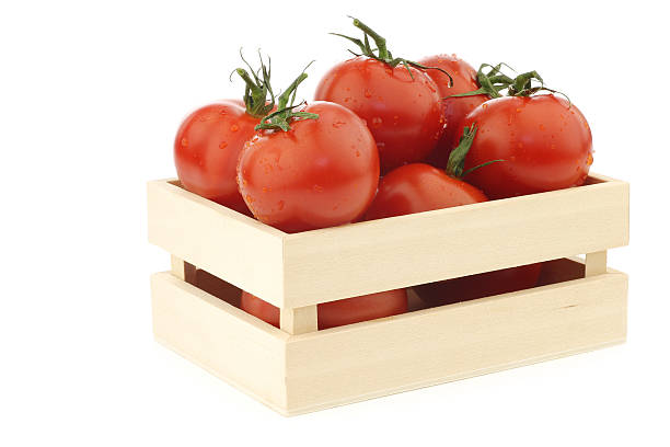 istock fresh tomatoes in a wooden box 494768113