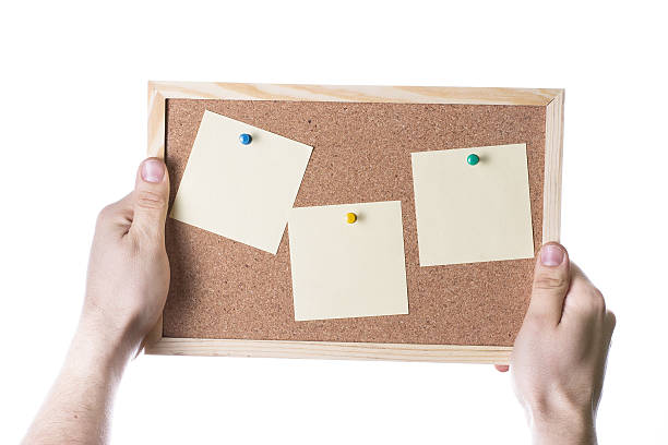 istock Hand hold the cork board isolated on white background 494768371