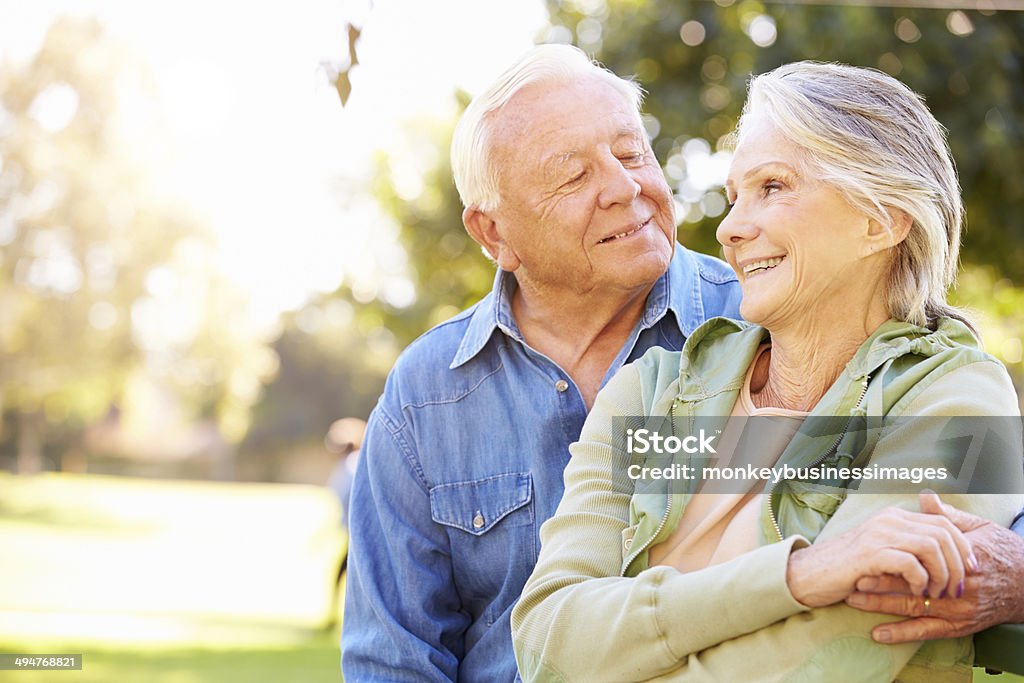 Outdoor Portrait Of Loving Senior Couple Outdoor Portrait Of Loving Senior Couple Smiling Active Seniors Stock Photo