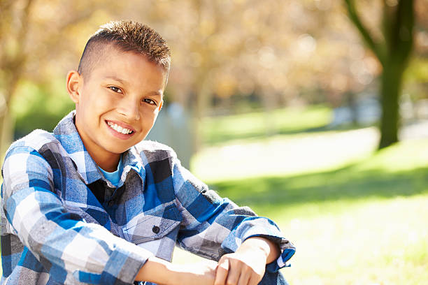 Portrait Of Hispanic Boy In Countryside Portrait Of Hispanic Boy In Countryside Smiling To Camera 12 13 years stock pictures, royalty-free photos & images