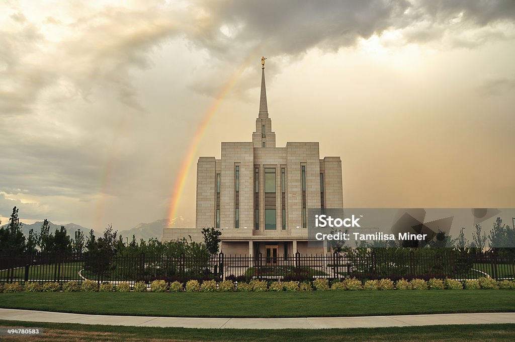 Temple Rainbows The West side of the Oquirrh Mountain Temple of the Church of Jesus Christ of Latter-day Saints ("LDS" or aka Mormon), located in South Jordan, Utah. A double rainbow shines on the North side. A sculpture of the Angel Moroni sits atop the spire. The temple is centered; landscape orientation. This temple has been in operation since 2009. Mormons go to any of these temples to be married for life and eternity.  Mormonism Stock Photo