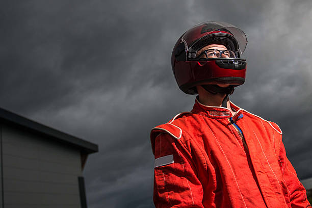 istock Race car driver wearing protective helmet 494781299