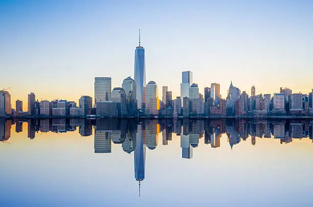 Manhattan Skyline with the One World Trade Center building at twilight, New York City