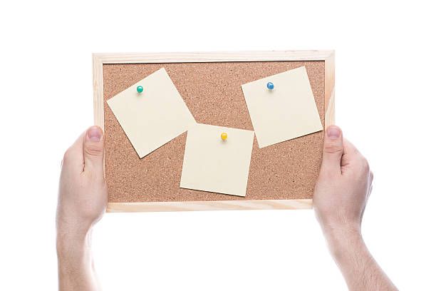 istock Hand hold the cork board isolated on white background 494781953