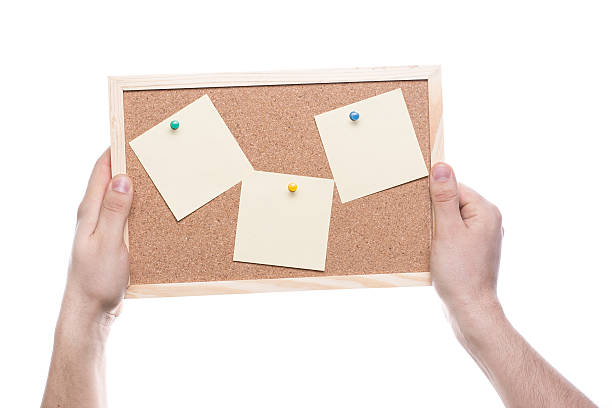 istock Hand hold the cork board isolated on white background 494781955