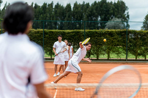 People taking tennis lessons