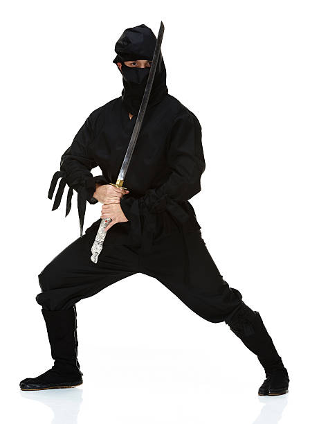 istock Front view of ninja standing with sword 494782551