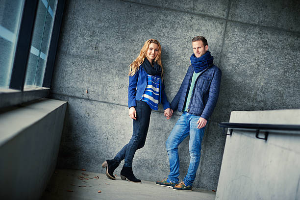 istock Couple Leaning Against The Wall 494783965