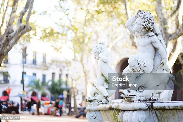 Cherubim On A Dolphin In A Fountain At Montevideo Stock Photo - Download Image Now - Architecture, Autumn, Capital Cities