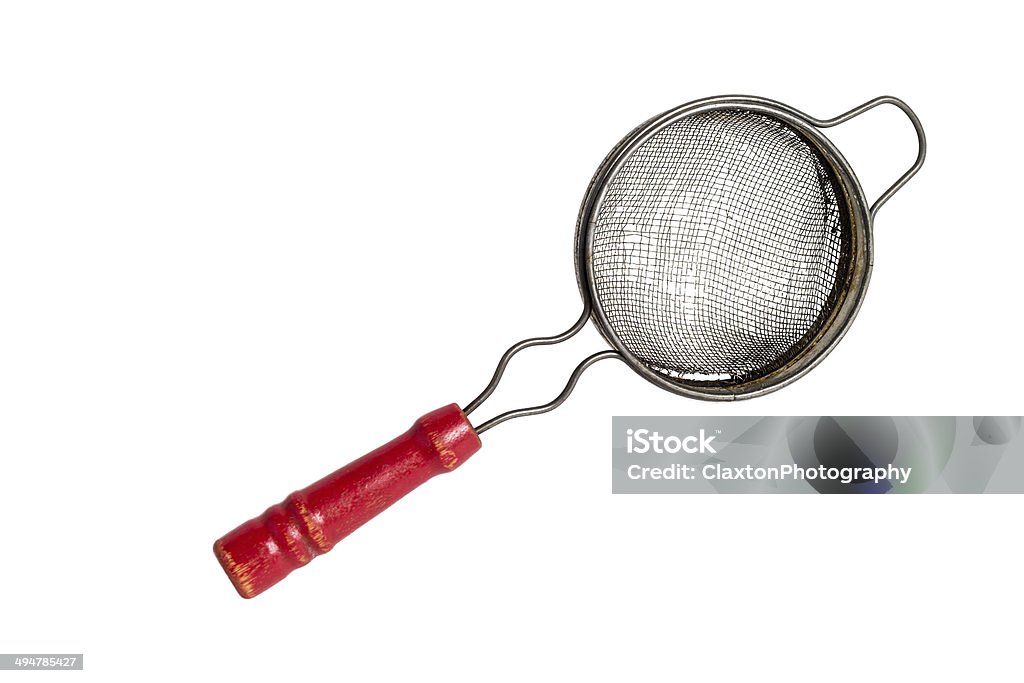 Antique Tea Strainer Antique mesh tea strainer with a red wooden handle on a solid white background Antique Stock Photo