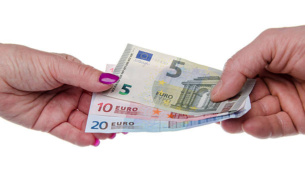 istock Man's hand giving banknotes to a woman's hand 494786893