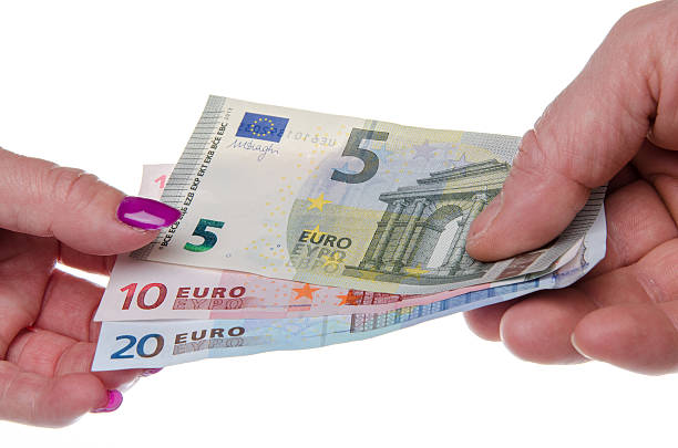 istock Man's hand giving banknotes to a woman's hand 494786907