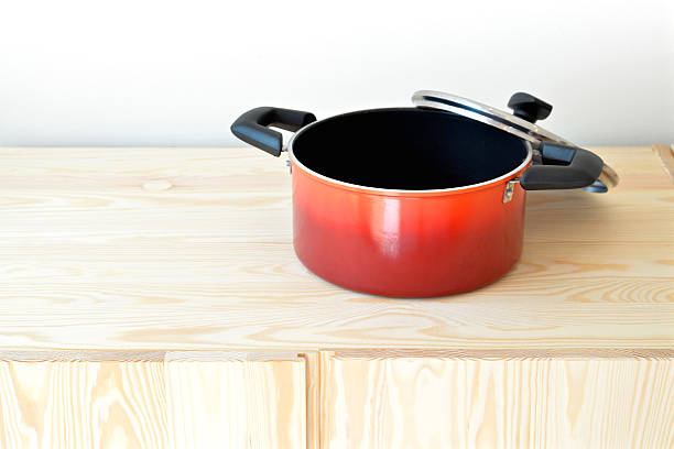 istock Red pot on the cupboard at home. 494787082