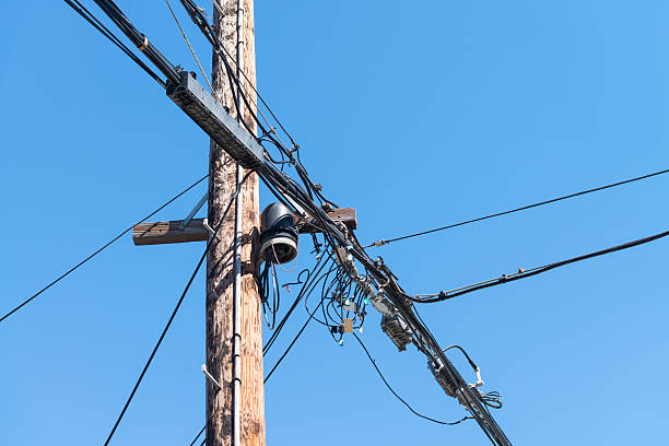istock Tangle of wires on a pole 494787120