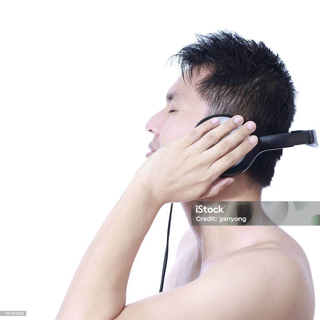 Asian handsome man listen to music by headphone Asian handsome man listen to music by headphone, isolated Adult Stock Photo