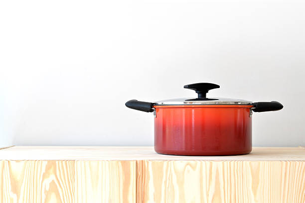 istock Red pot on the cupboard at home. 494787816