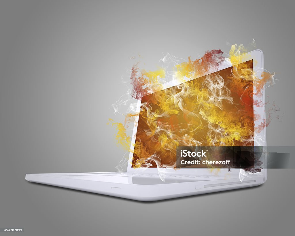 Open white laptop emits colored smoke Open white laptop emits colored smoke. The technology concept Emitting Stock Photo