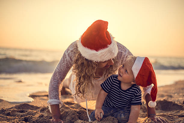 istock Mother and son Christmas time at the beach 494788746