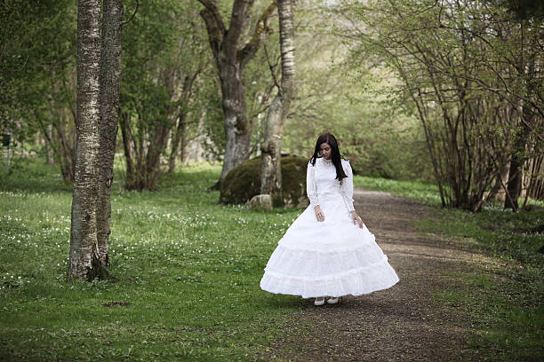 istock bride wedding dress in forest vintage tree 494789884