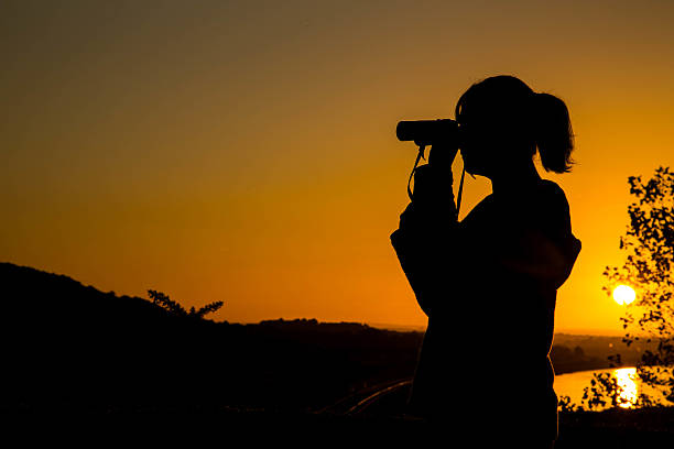 istock Young girl looking through binoculars 494810684