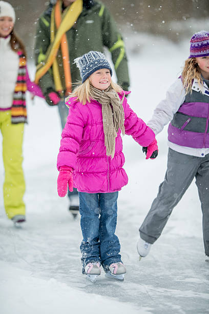 istock Family Ice Skating on a Frozen Pond 494810830
