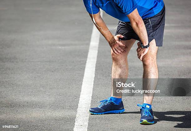 Tired Male Runner Resting After Training Stock Photo - Download Image Now - Men, Running, Stadium