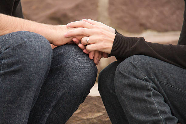 istock Young couple in Love holding hands with engagement ring 494812356