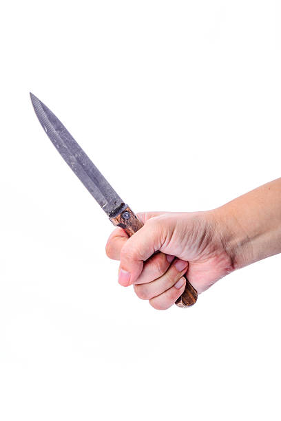 istock Dirty knife in hand isolated on a white background 494814193