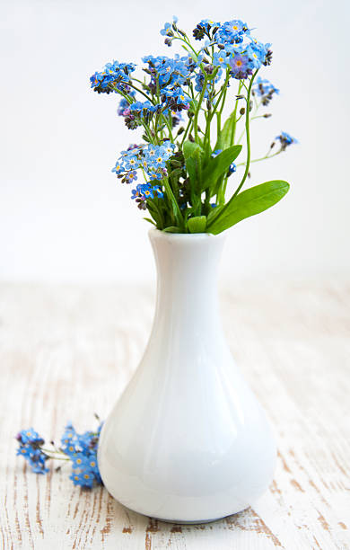 istock forget-me-nots on wooden table 494814993