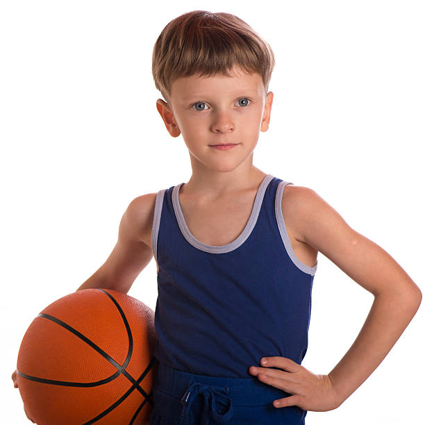 istock The boy held a basketball ball to a hip 494826374