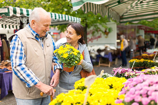 istock Senior man with caregiver shopping 494827364